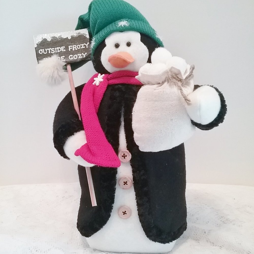 Penguin with bag of snowballs